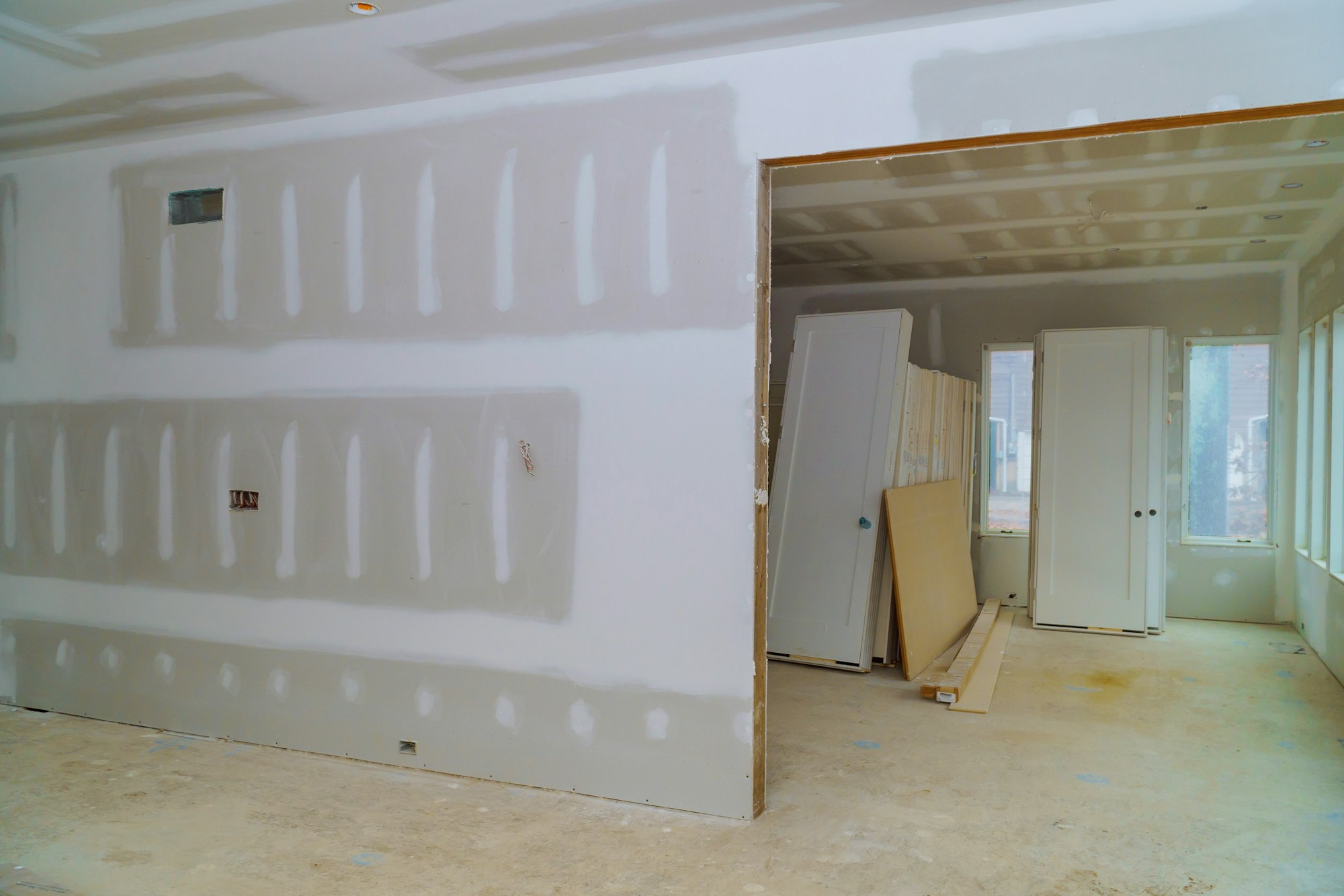 Interior construction of housing with drywall installed door for a new home before installing